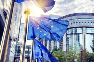 Eu,Flags,Waving,In,Front,Of,European,Parliament,Building.,Brussels,