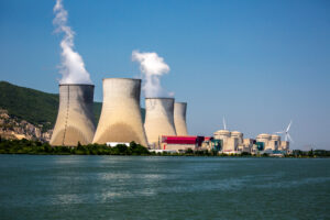 Viviers, France – 6/6/2015: Four Cooling towers, part of a nuclear power plant complex along the Rhone River near Meysse and Cruas, France.