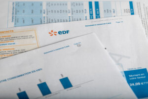 Paris, France – October 04, 2021 : EDF Electricity invoice close-up of logo. Concept for price rise, payment, energy provider, fuel, inflation and paying …