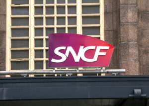 Le Havre, France : SNCF logo at a railway station. SNCF is the National society of French railway in France and it is a state-owned railway company