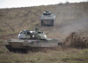 French soldiers, on a Leclerc Tank, simulate an attack on a building in Jeoffrecourt village which is a town of 5000 inhabitants, with tall buildings, commercial areas at the training military camp of Sissonne, during a training session, on november 29, 2