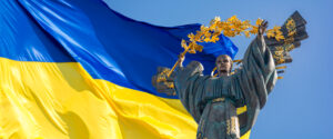 Monument of Independence of Ukraine in front of the Ukrainian fl