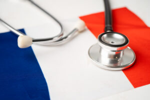 Black stethoscope on France flag background, Business and financ