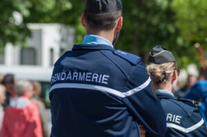 Brisach – France – 1 May 2018 – french gendarmerie patrol in lily of the valley party in the street