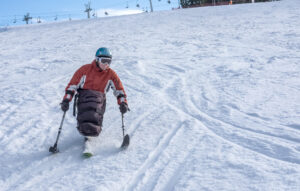 disabled athlete and  Winter Sport,  handicapped person and Mono Ski, handicapped athlete goes mono ski downhill skiing