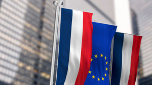 Close-up of France and European Union vertical flags waving